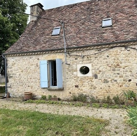 Shuttered stone facade of the retreat house